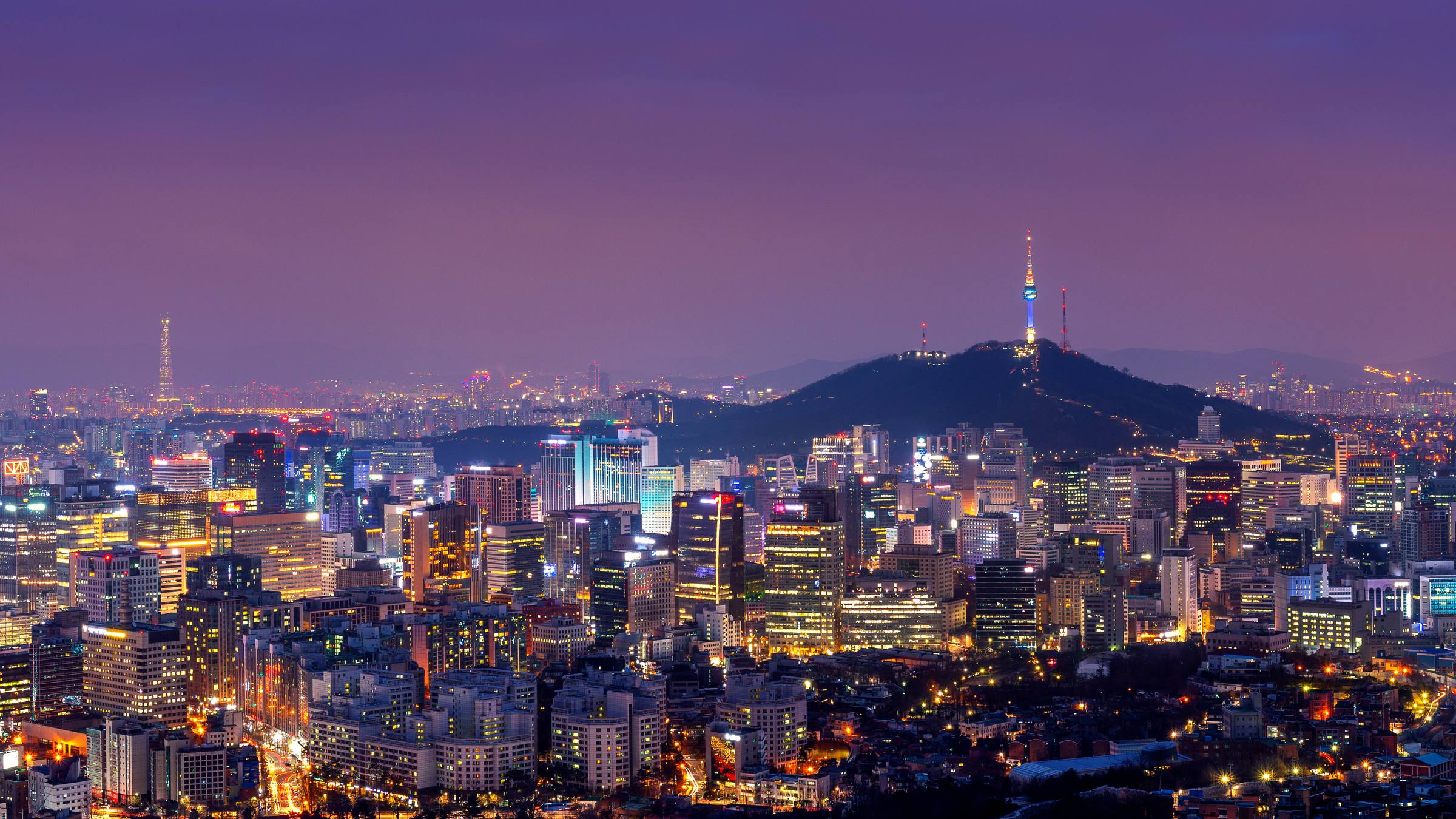 The Seoul skyline at dusk, with N Seoul Tower rising above Namsan.